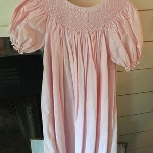 Light pink smocked dress with pearl detail!